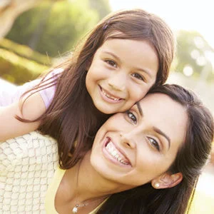 A happy mom and daughter because they are lice free