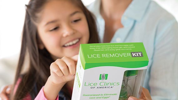 Mom & daughter reading the box of the Lice Remover Kit